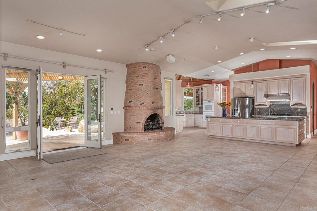 6944 Rancho Cielo Rancho Santa Fe, CA 92067 - Photo 12 of 37 a view of kitchen with furniture and large window