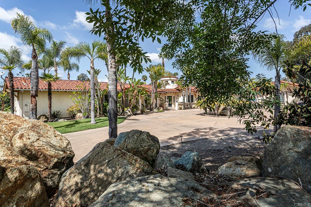 6944 Rancho Cielo Rancho Santa Fe, CA 92067 - Photo 2 of 37 a view of a yard with plants and trees