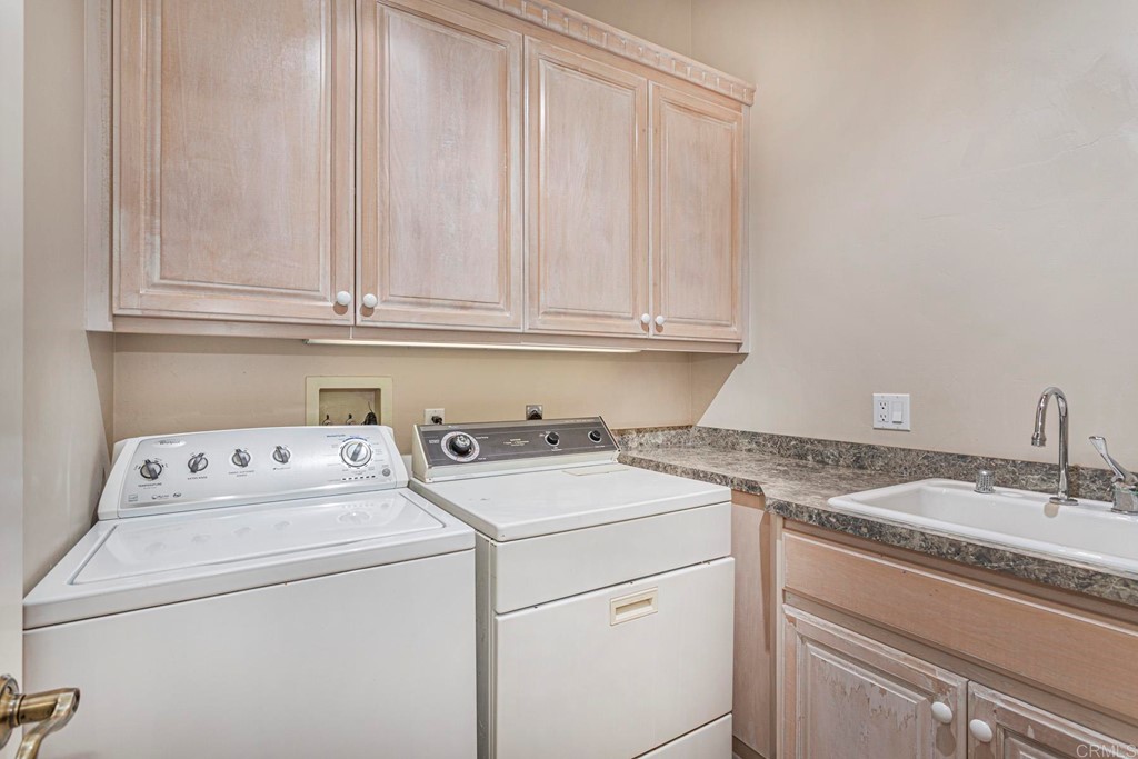 6944 Rancho Cielo Rancho Santa Fe, CA 92067 - Photo 22 of 37 a utility room with dryer and washer