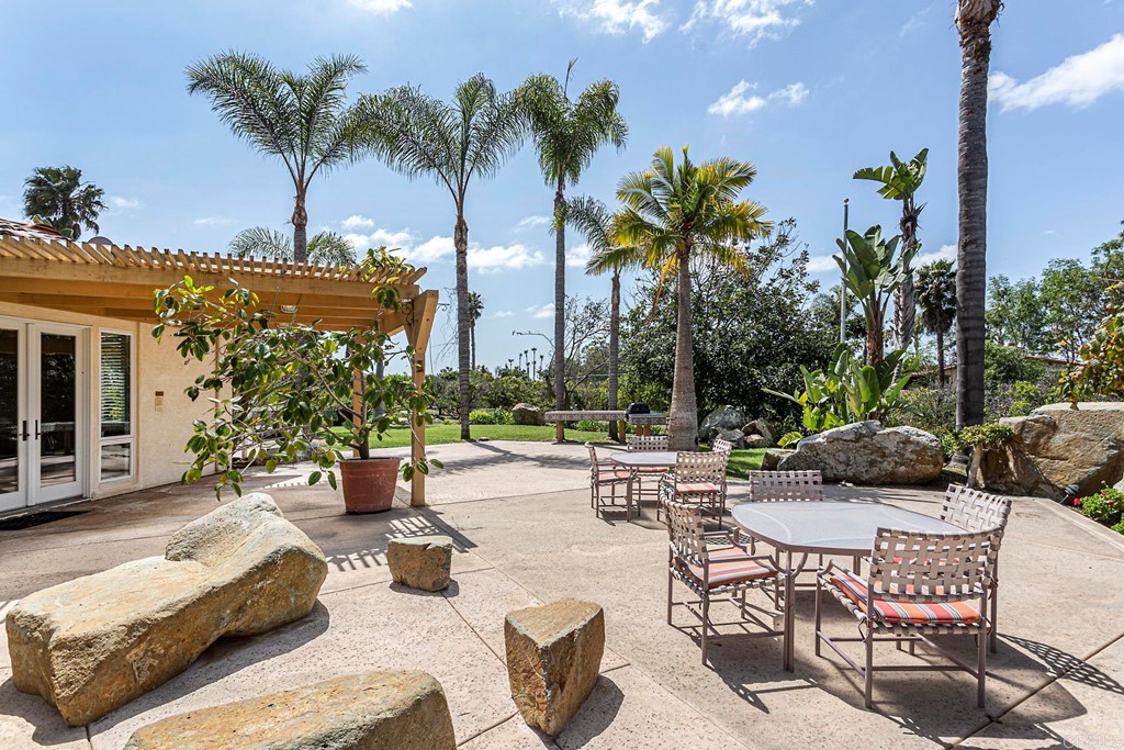 6944 Rancho Cielo Rancho Santa Fe, CA 92067 - Photo 27 of 37 a view of a patio with couches and chairs