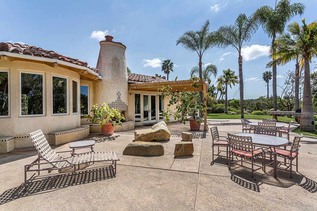 6944 Rancho Cielo Rancho Santa Fe, CA 92067 - Photo 28 of 37 a view of a patio with swimming pool