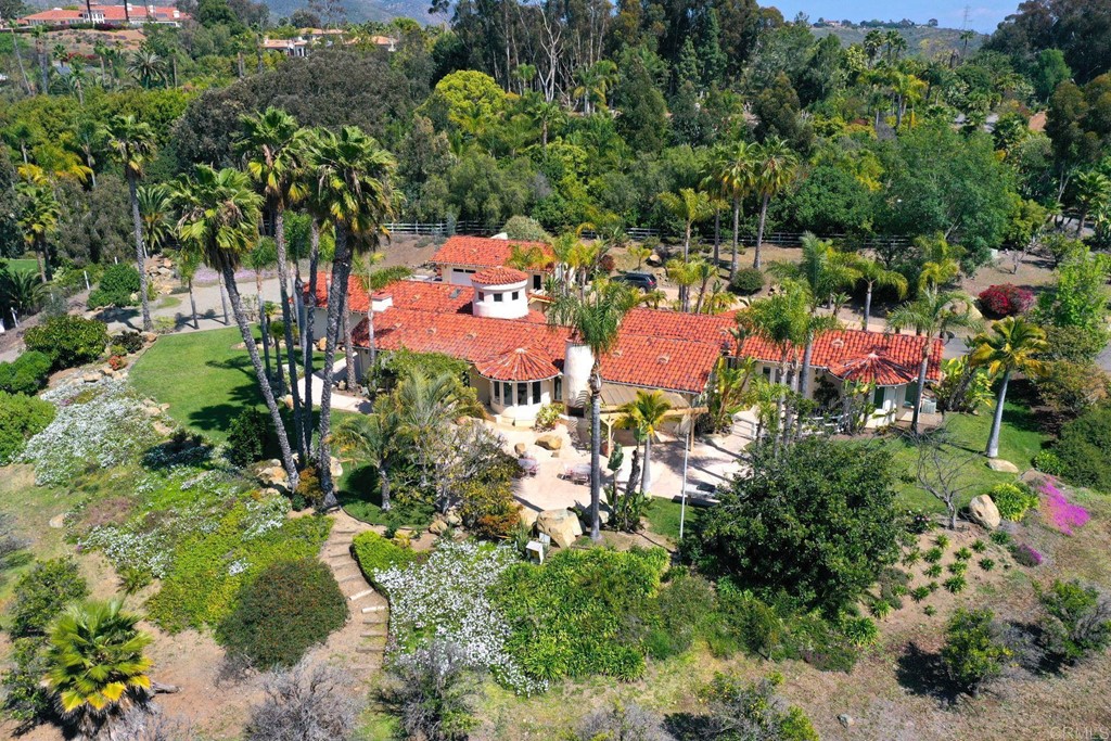 6944 Rancho Cielo Rancho Santa Fe, CA 92067 - Photo 35 of 37 an aerial view of a house with a yard and lake view