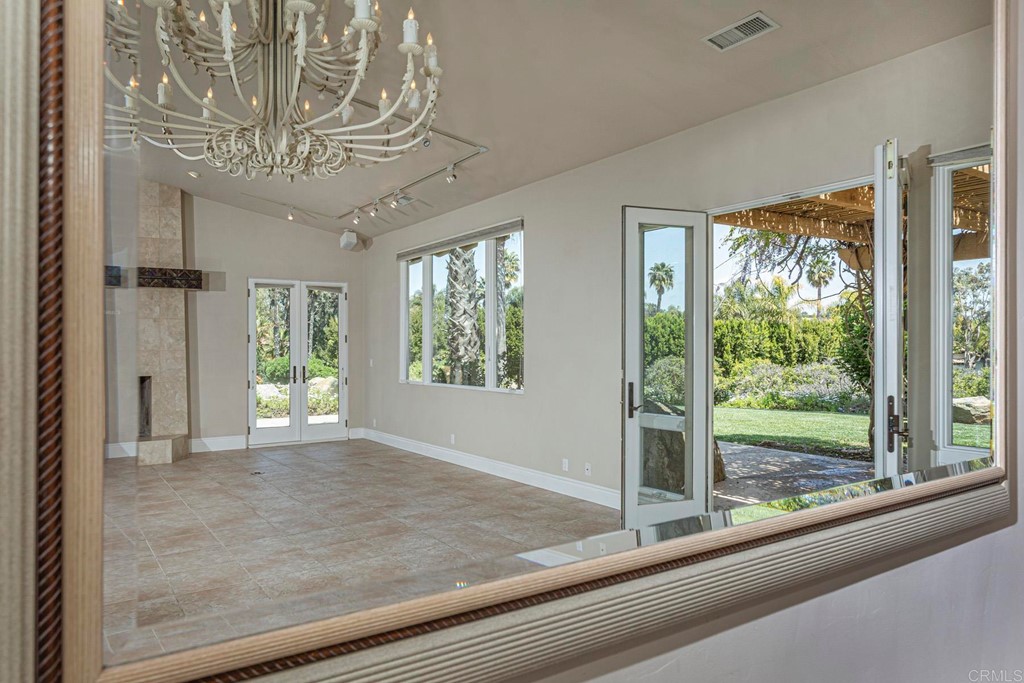 6944 Rancho Cielo Rancho Santa Fe, CA 92067 - Photo 4 of 37 a view of a livingroom with a furniture window and outside view