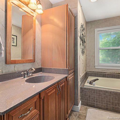 4190 Highland Road Highland, MI 48357 - Photo 11 of 27 huge soaker tub, granite countertops!