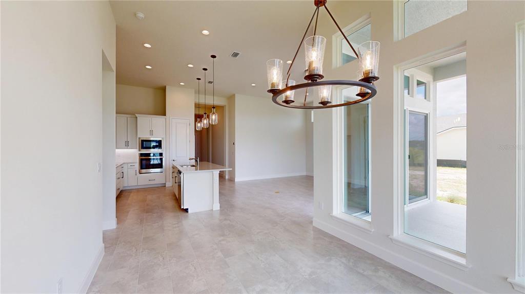 247 Azure Mist Way Daytona Beach, FL 32124 - Photo 15 of 40 a view of a living room and chandelier