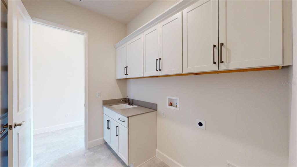 247 Azure Mist Way Daytona Beach, FL 32124 - Photo 19 of 40 a view of cabinets with window