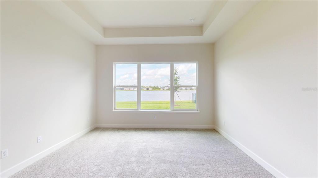 247 Azure Mist Way Daytona Beach, FL 32124 - Photo 21 of 40 an empty room with windows
