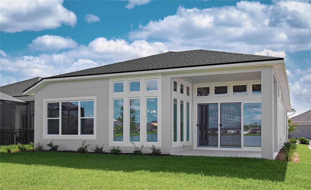 247 Azure Mist Way Daytona Beach, FL 32124 - Photo 31 of 40 a front view of a house with a yard