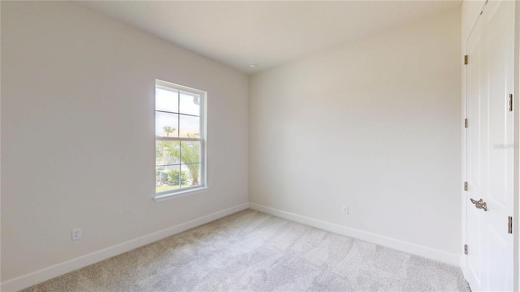 247 Azure Mist Way Daytona Beach, FL 32124 - Photo 7 of 40 an empty room with a window