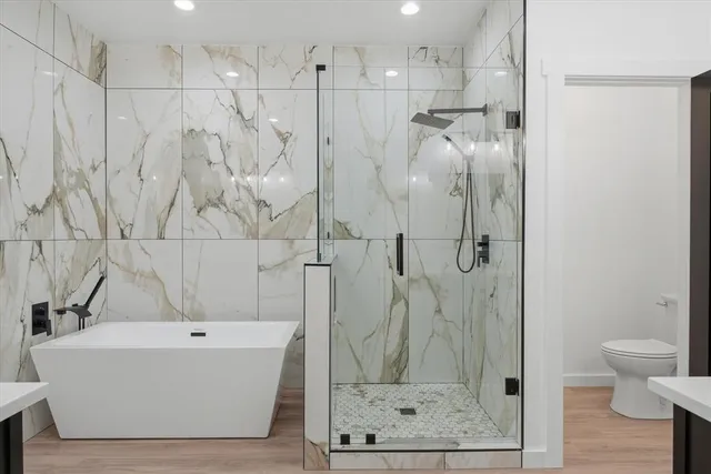 a bathroom with a bathtub and a shower