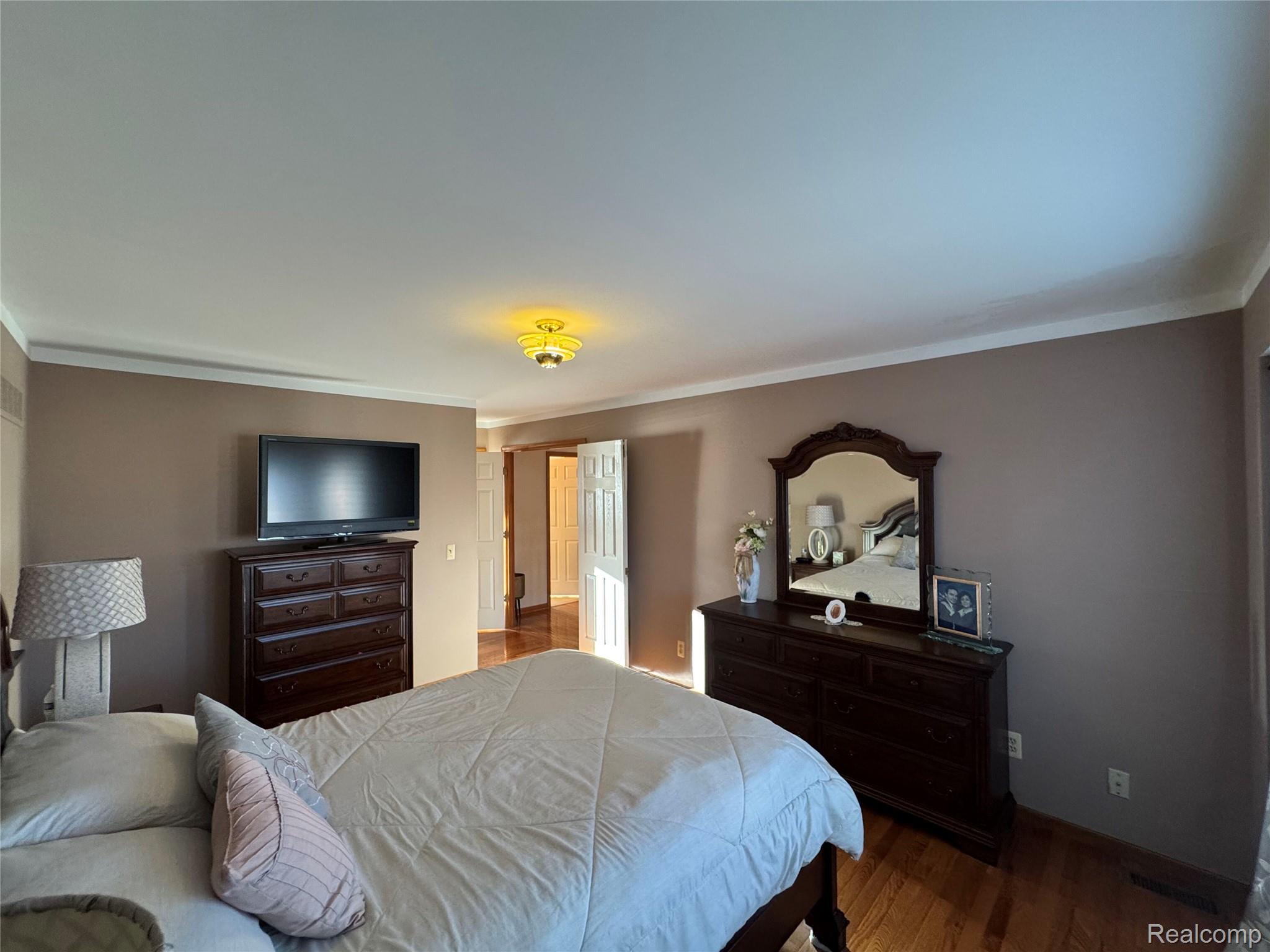 48583 Tilch Road Macomb, MI 48044 - Photo 40 of 53 Bedroom with ornamental molding and wood finished floors