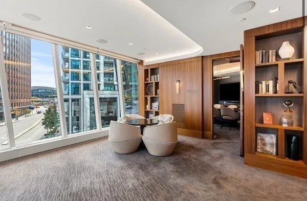 a living room with furniture and large window