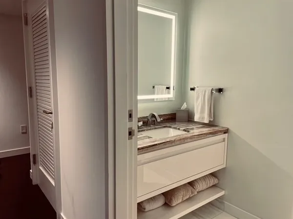 a stove top oven sitting inside of a kitchen