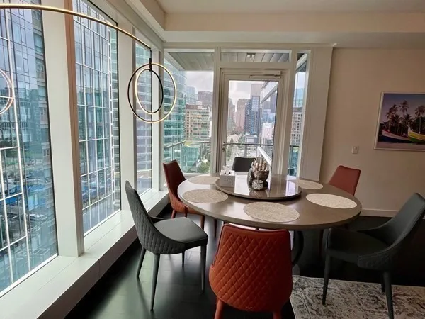 a view of a dining room with furniture window and outside view