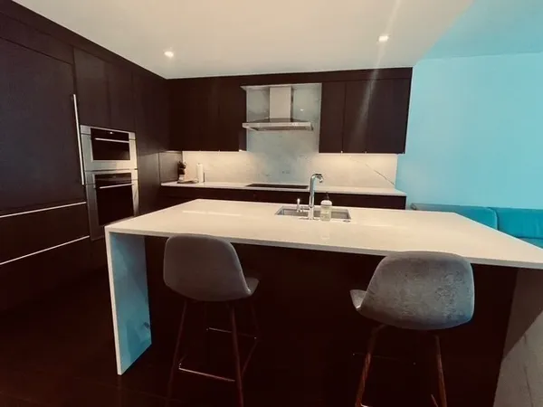 a kitchen with a sink cabinets and window