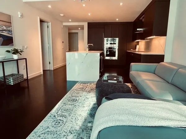 a hallway with a table and chairs