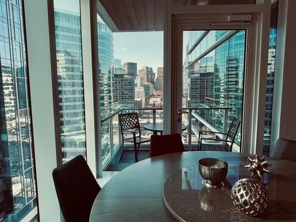 a view of a dining room with furniture window and outside view