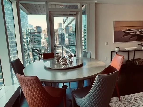a view of a balcony with a table and chairs