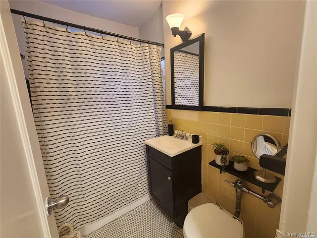 a bathroom with a toilet and a sink