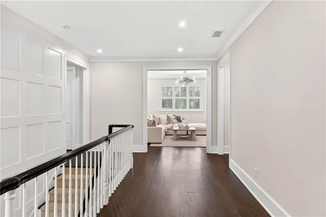 a dining room with furniture window and wooden floor