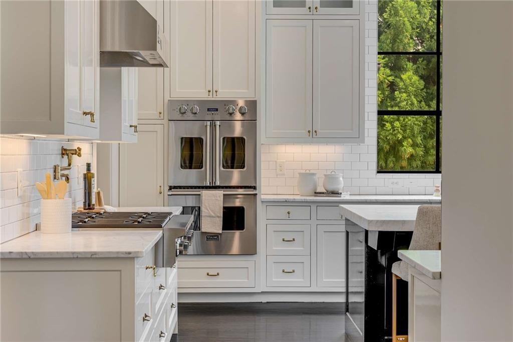 3773 Randall Road Southeast Atlanta, GA 30339 - Photo 13 of 64 a kitchen with stainless steel appliances a stove a sink and a refrigerator