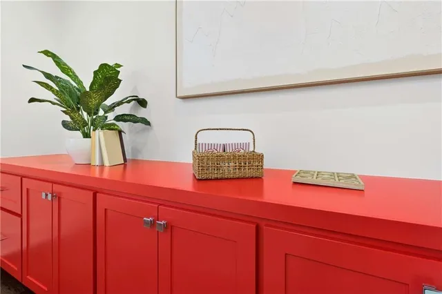 a bedroom with bed and a large window