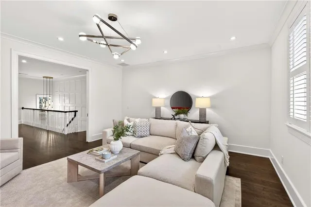 a front view of a house with yard and green space