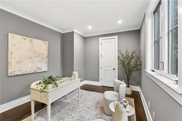 a front view of a house with a yard table and chairs