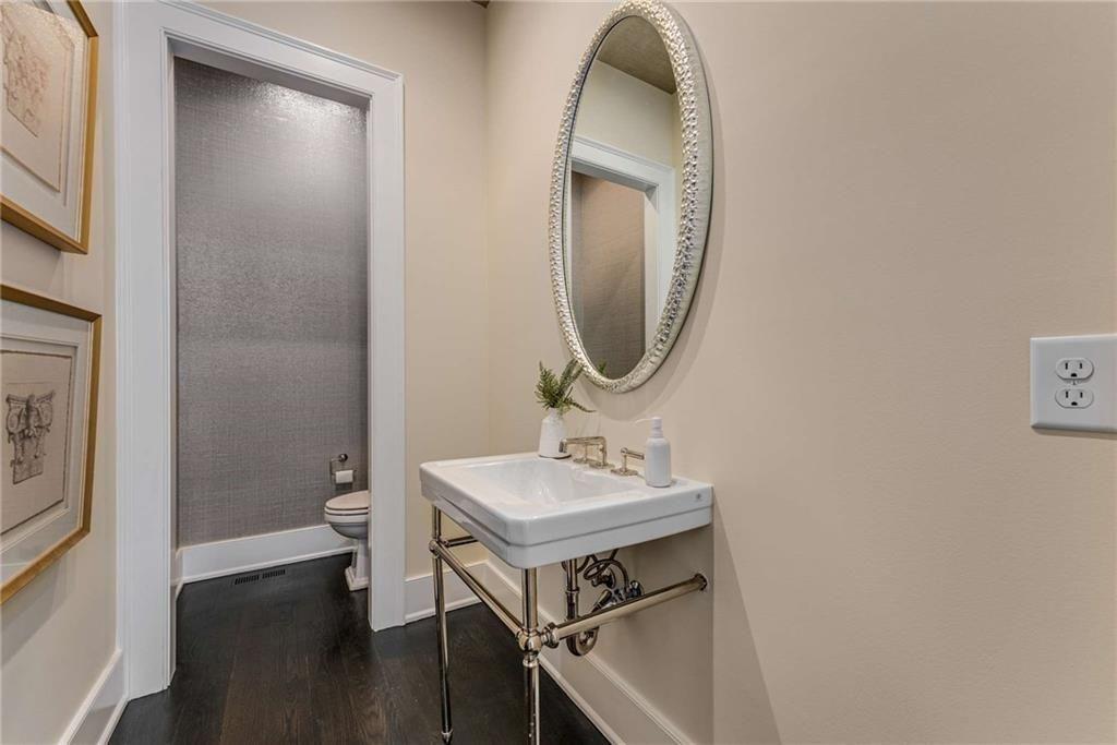 3773 Randall Road Southeast Atlanta, GA 30339 - Photo 20 of 64 a bathroom with a sink a toilet and a mirror