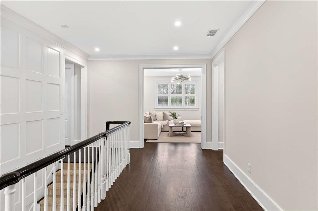 3773 Randall Road Southeast Atlanta, GA 30339 - Photo 32 of 64 a view of a hallway with wooden floor and furniture