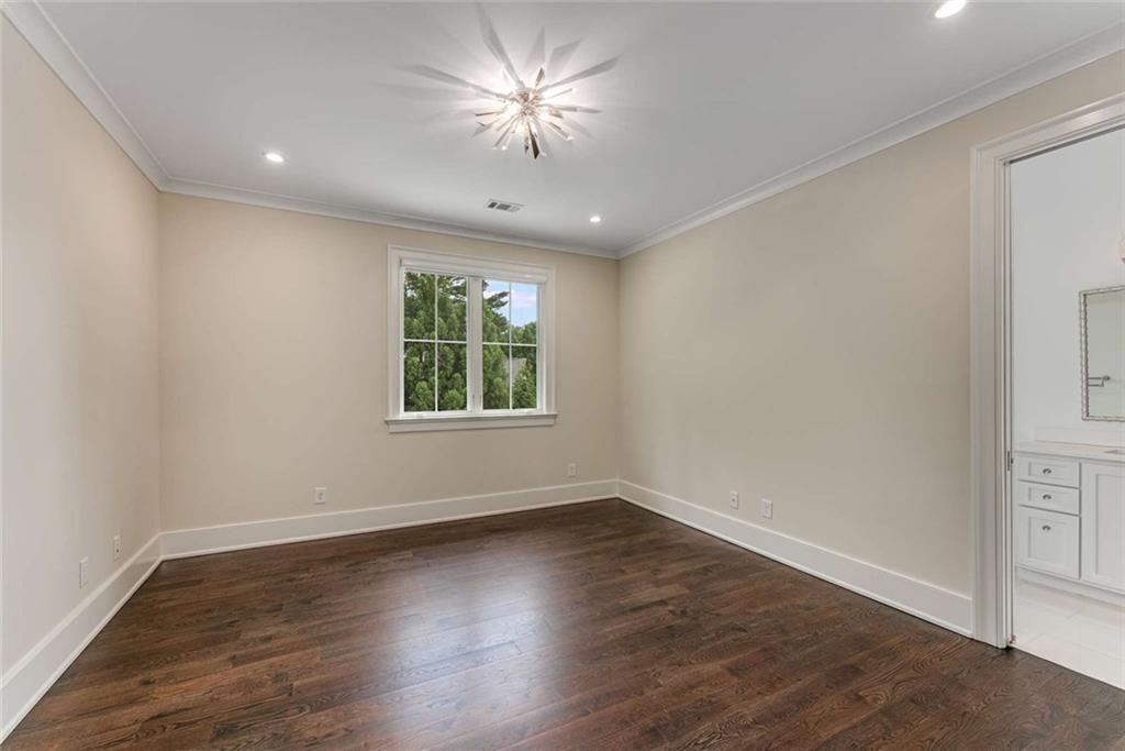 3773 Randall Road Southeast Atlanta, GA 30339 - Photo 47 of 64 an empty room with wooden floor and windows
