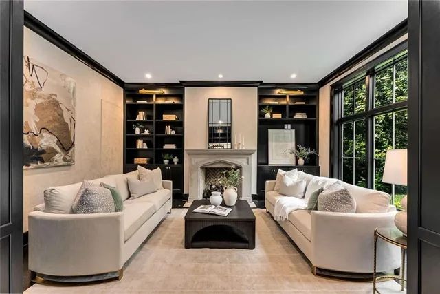 a living room with furniture and a potted plant