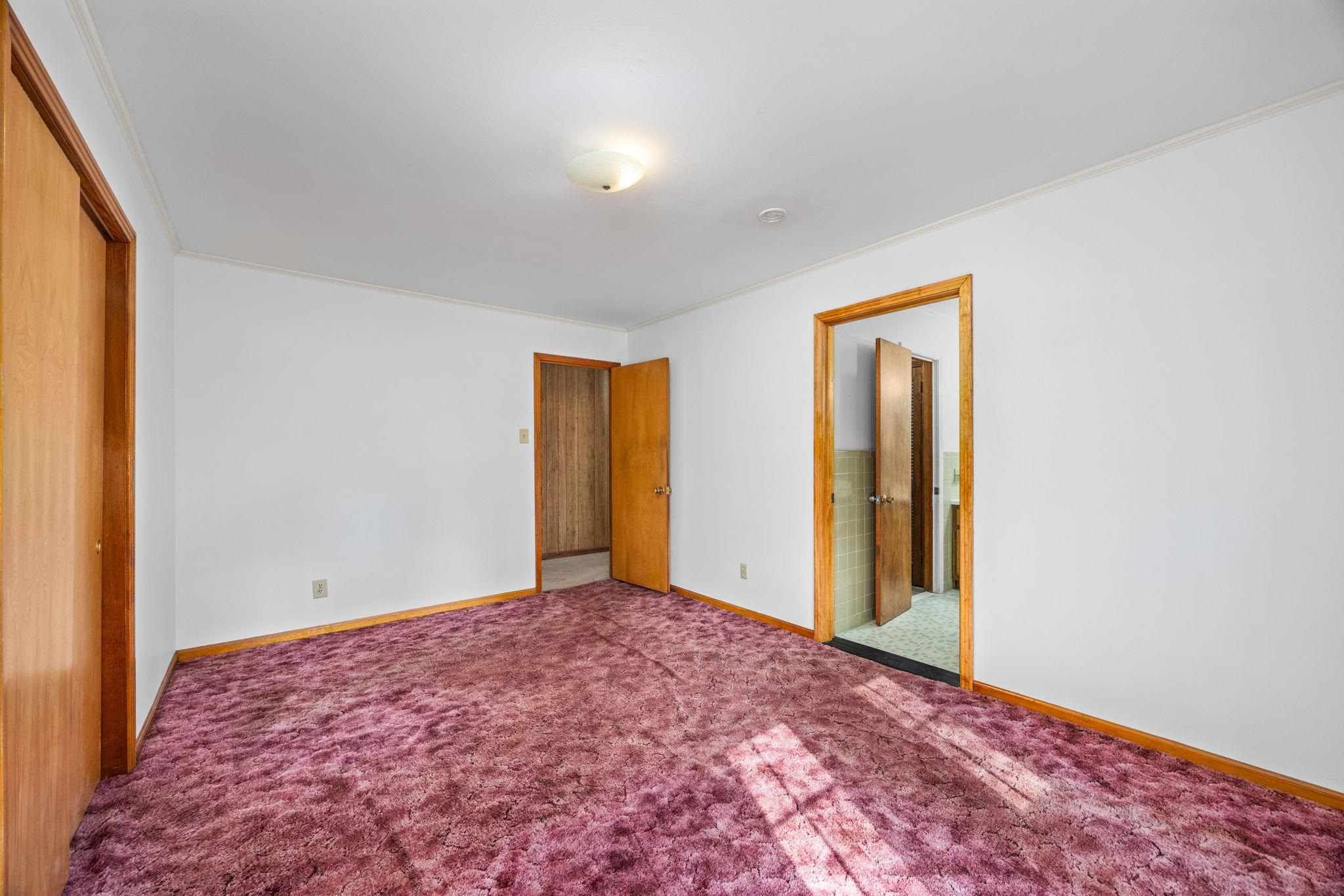 213 Forrest School Road Corinth, MS 38834 - Photo 14 of 40 Unfurnished bedroom with a closet, carpet floors, and ornamental molding