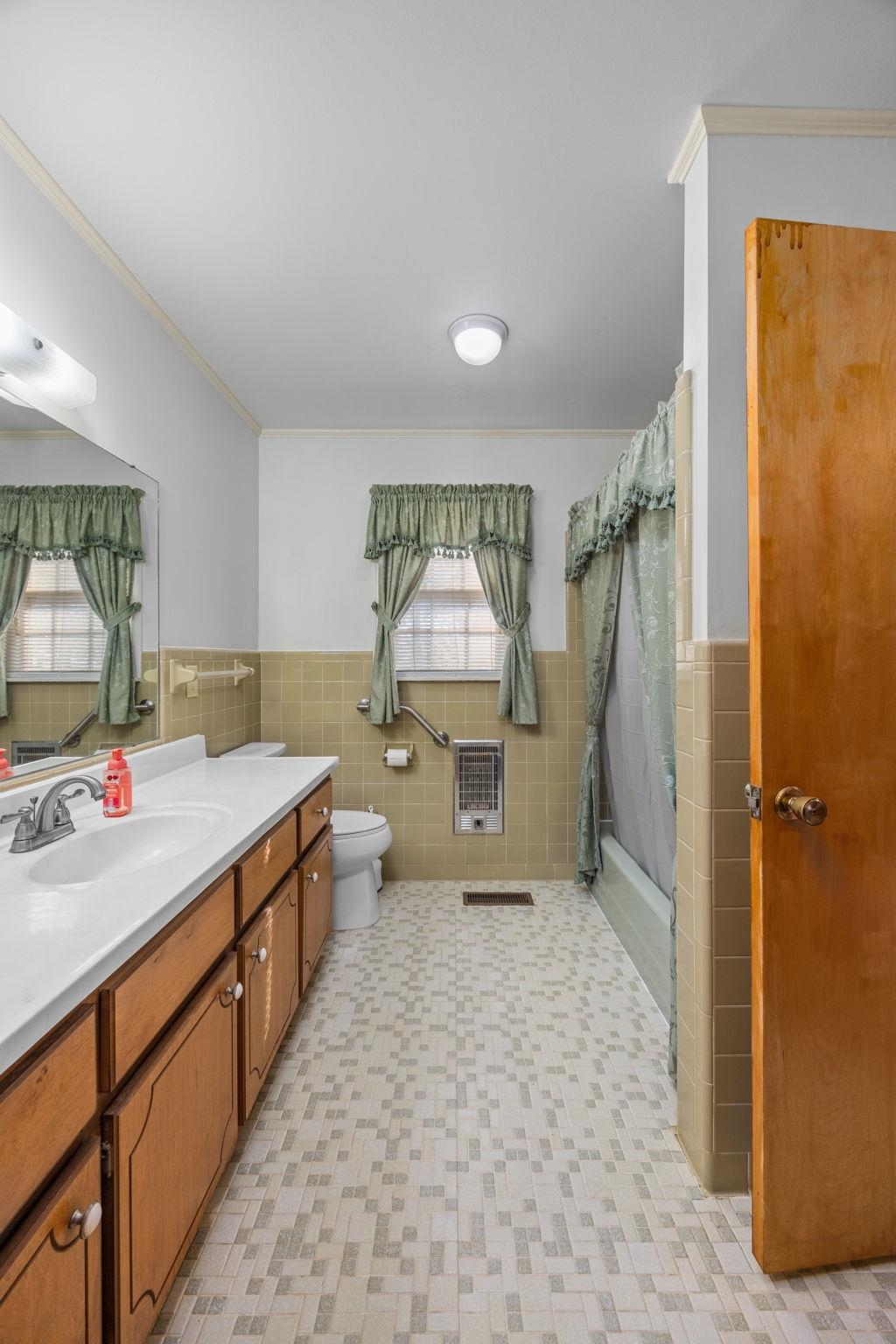 213 Forrest School Road Corinth, MS 38834 - Photo 15 of 40 Full bathroom featuring heating unit, tile walls, and ornamental molding