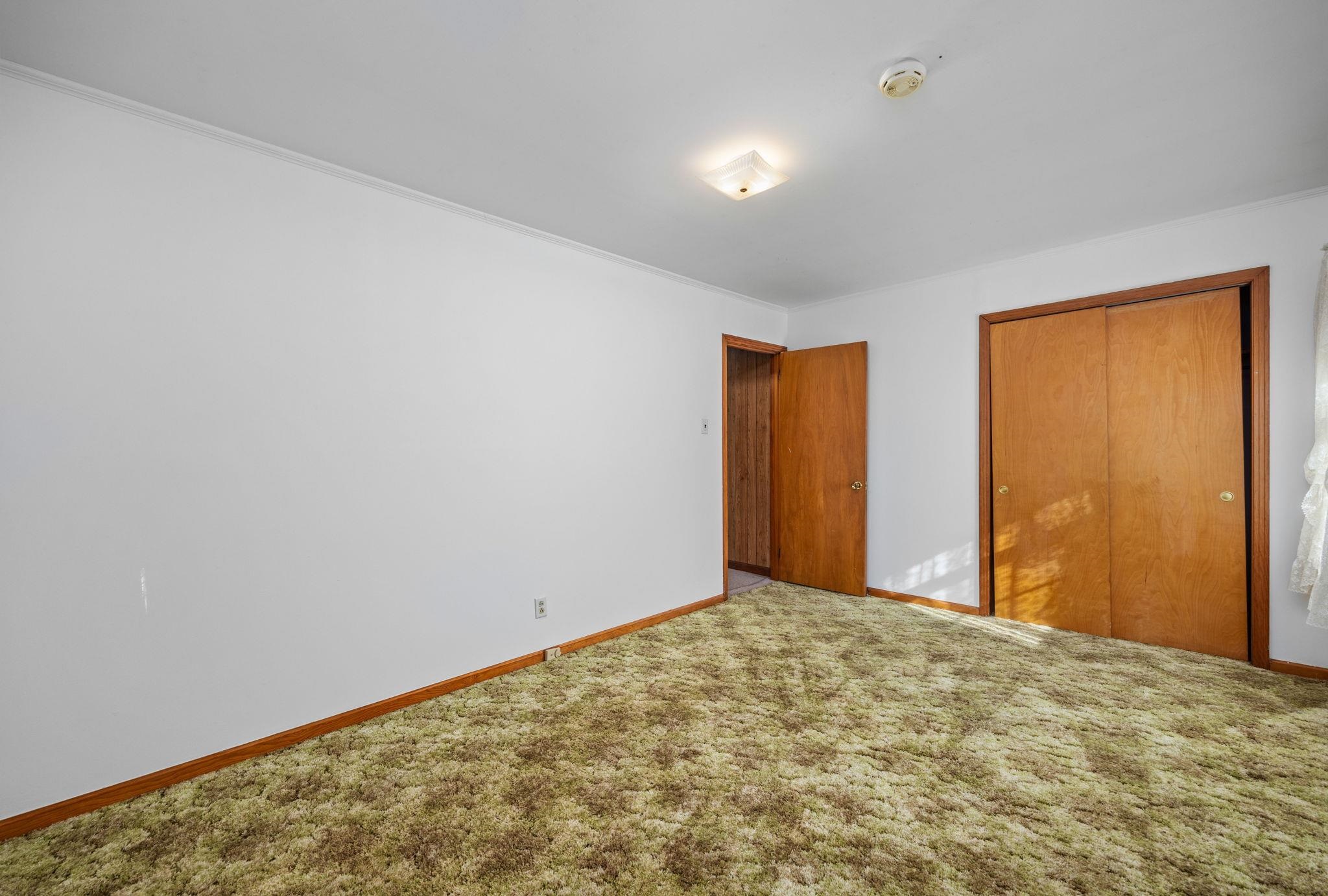 213 Forrest School Road Corinth, MS 38834 - Photo 17 of 40 Unfurnished bedroom featuring carpet flooring, a closet, and ornamental molding