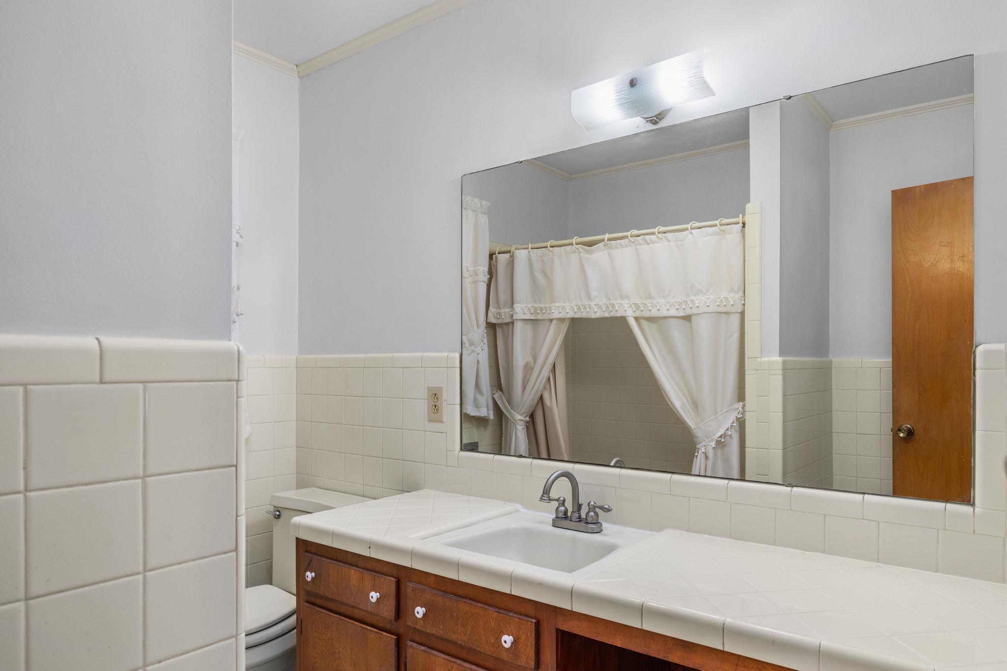 213 Forrest School Road Corinth, MS 38834 - Photo 21 of 40 Bathroom with vanity, toilet, and ornamental molding
