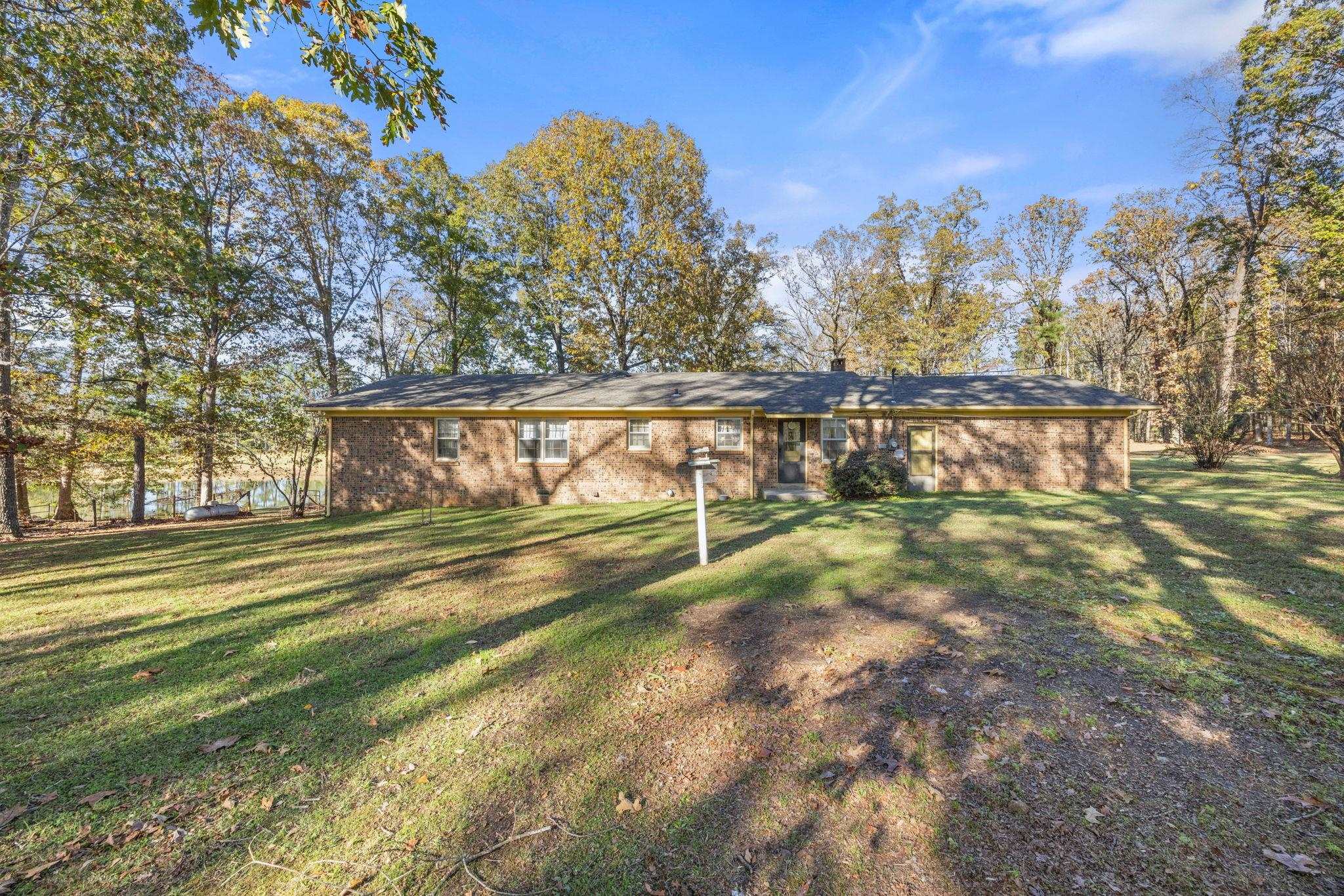 213 Forrest School Road Corinth, MS 38834 - Photo 25 of 40 Back of house with a lawn
