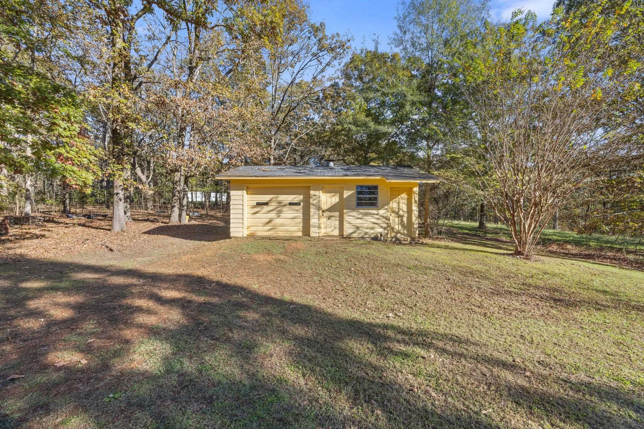 213 Forrest School Road Corinth, MS 38834 - Photo 29 of 40 View of outdoor structure with a yard and a garage