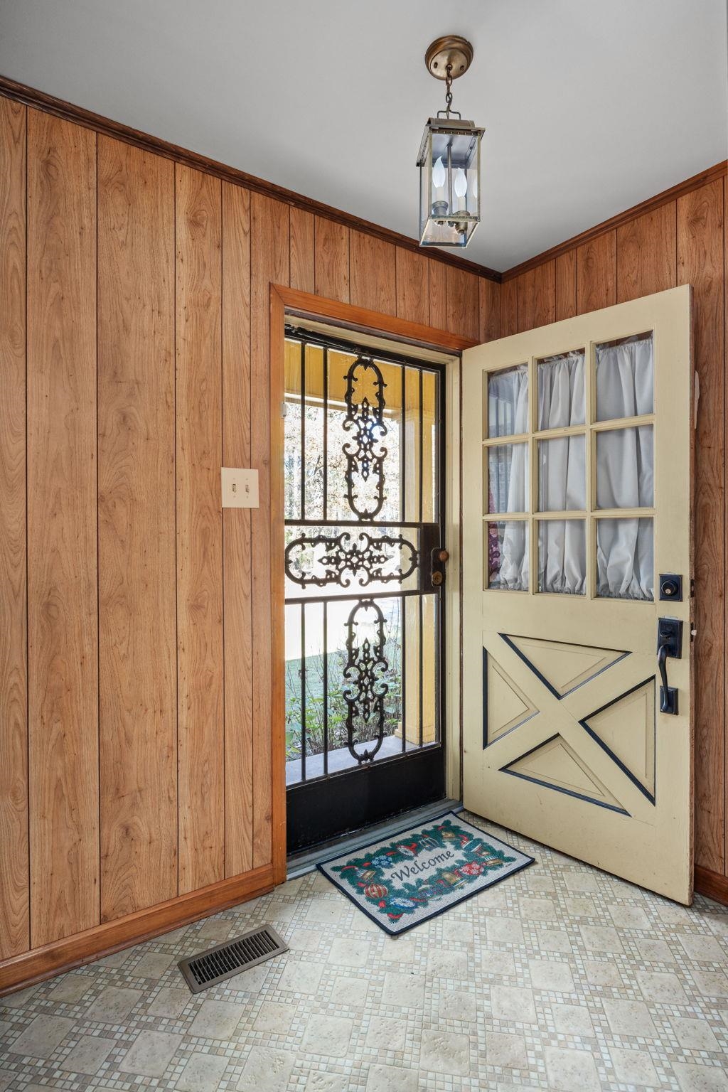 213 Forrest School Road Corinth, MS 38834 - Photo 3 of 40 Foyer entrance with wood walls and ornamental molding