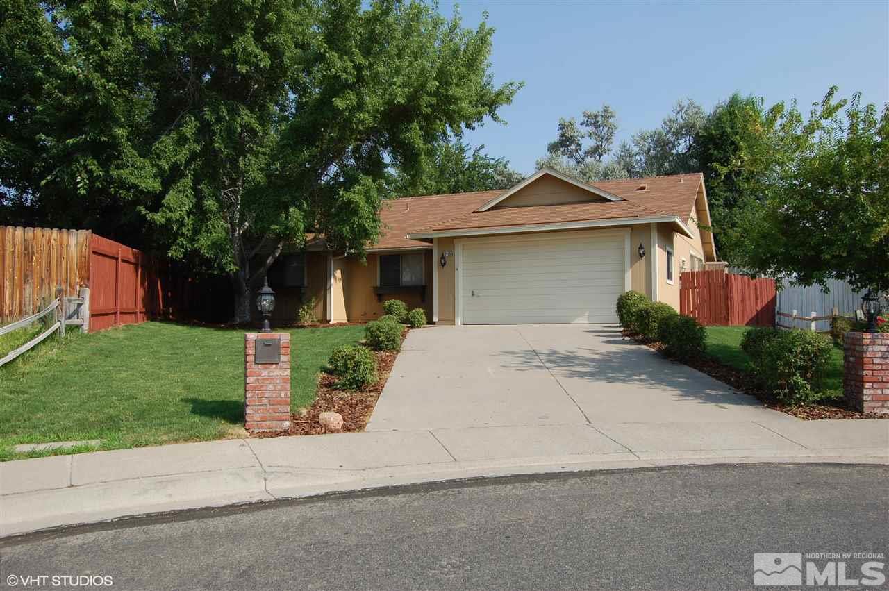 2415 Durango Court Reno, NV 89503 - Photo 1 of 25 a front view of a house with a yard and a garage