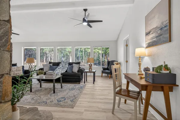 a living room with furniture and a fireplace