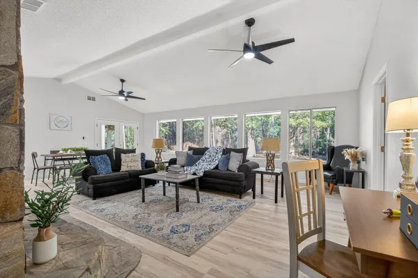 a living room with furniture and a fireplace