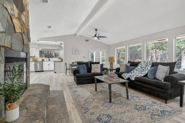 a living room with furniture and a large window