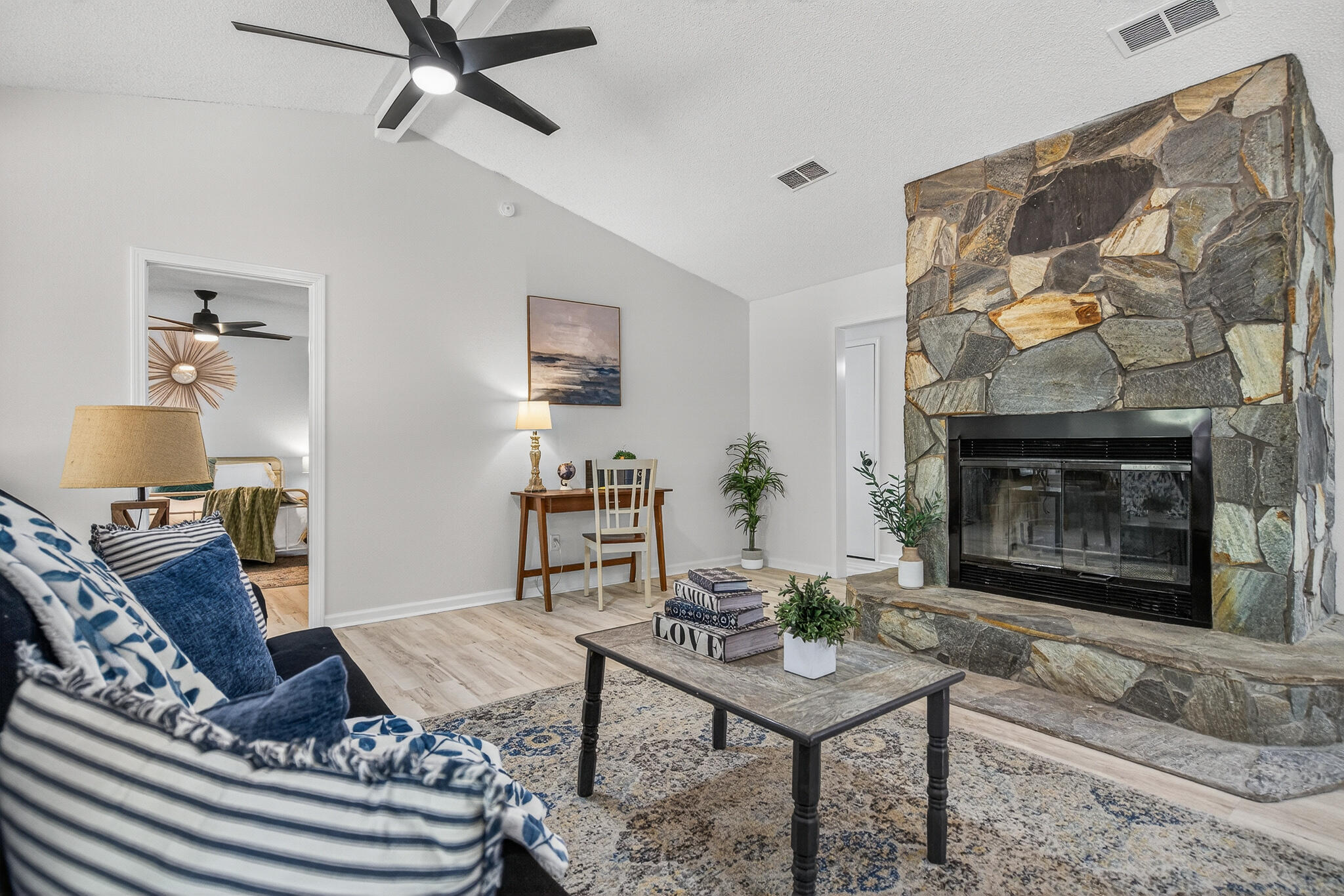 4297 Edge Perry Road Crestview, FL 32539 - Photo 20 of 70 a living room with furniture and a fireplace