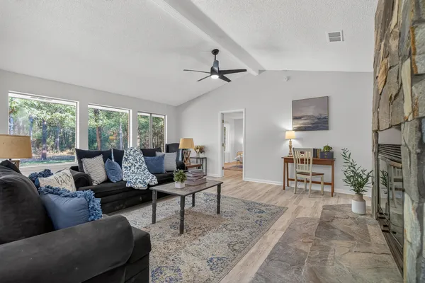 a living room with furniture and a large window