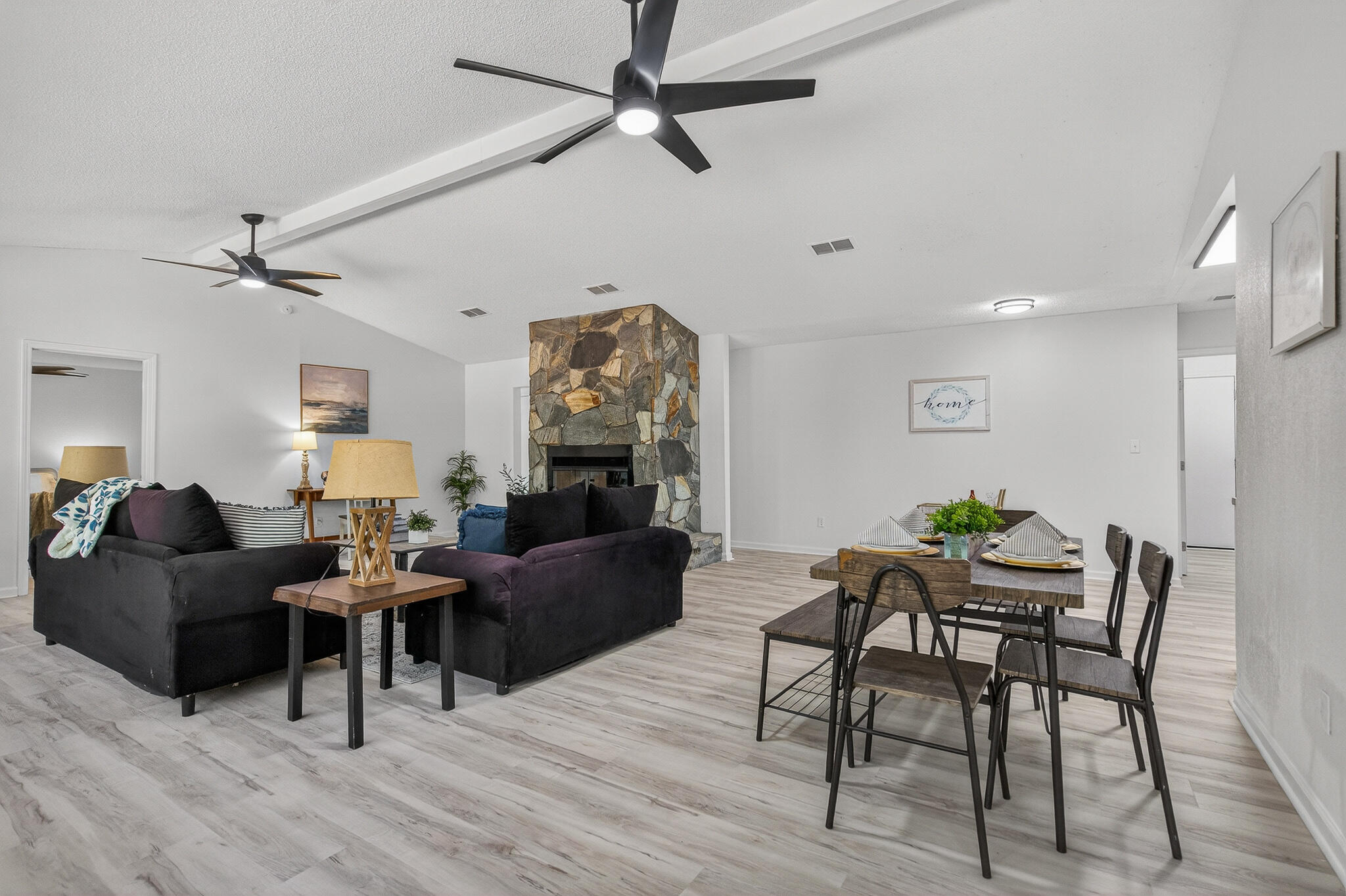 4297 Edge Perry Road Crestview, FL 32539 - Photo 25 of 70 a living room with furniture and a wooden floor