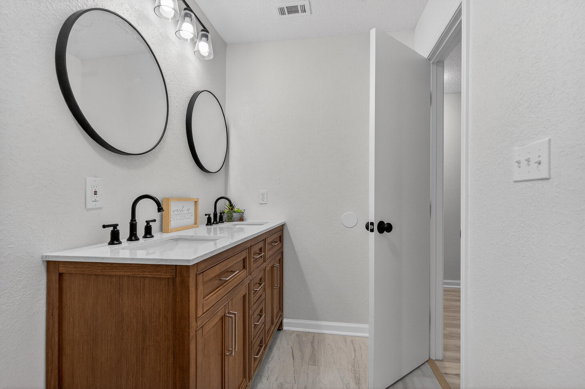 4297 Edge Perry Road Crestview, FL 32539 - Photo 42 of 70 a bathroom with a granite countertop sink a mirror and a shower