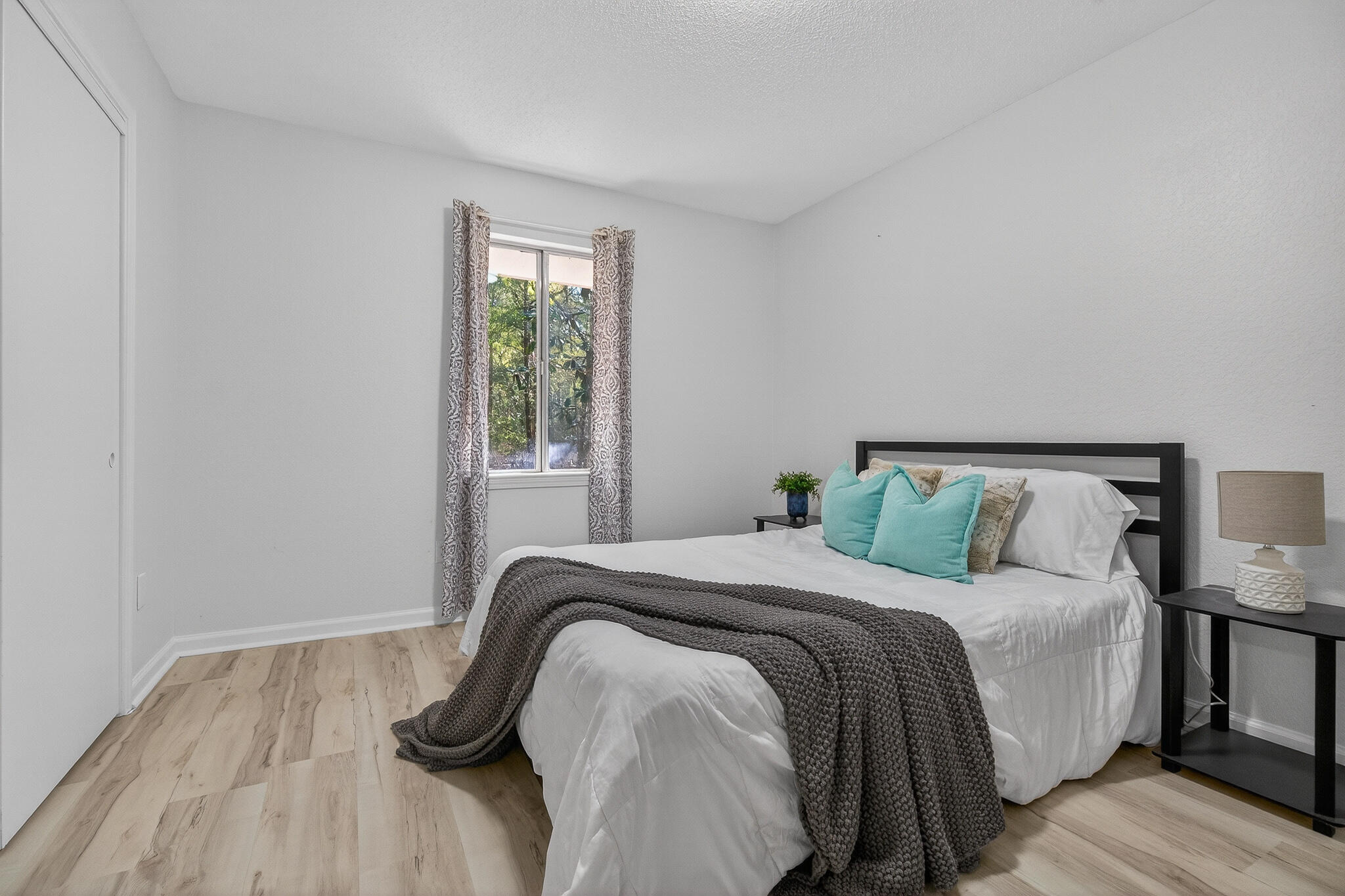 4297 Edge Perry Road Crestview, FL 32539 - Photo 44 of 70 a bed sitting in a bedroom next to a window