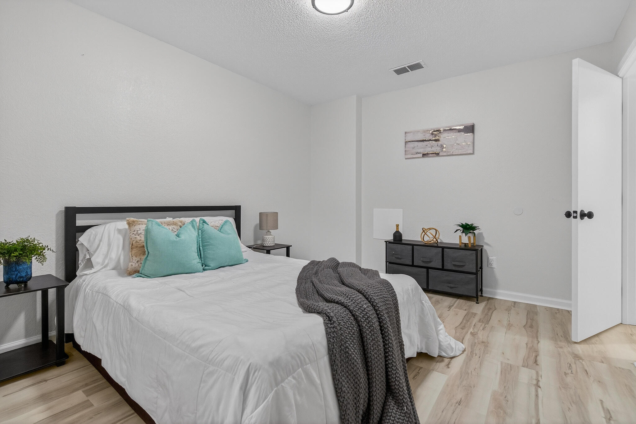 4297 Edge Perry Road Crestview, FL 32539 - Photo 46 of 70 a bedroom with a bed and a cabinets