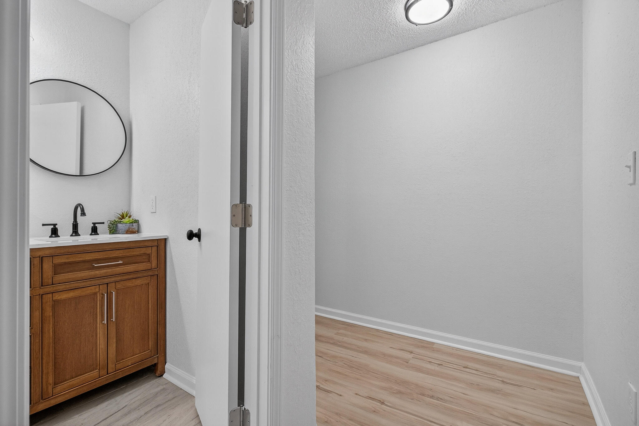 4297 Edge Perry Road Crestview, FL 32539 - Photo 48 of 70 a bathroom with a sink and a mirror